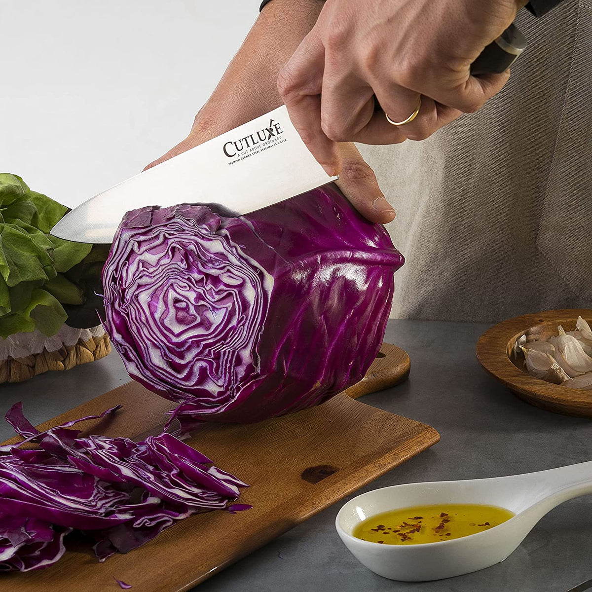 Product image 5 of 9: Sharp kitchen knife slicing purple cabbage on wooden cutting board, ideal for home cooks and chefs