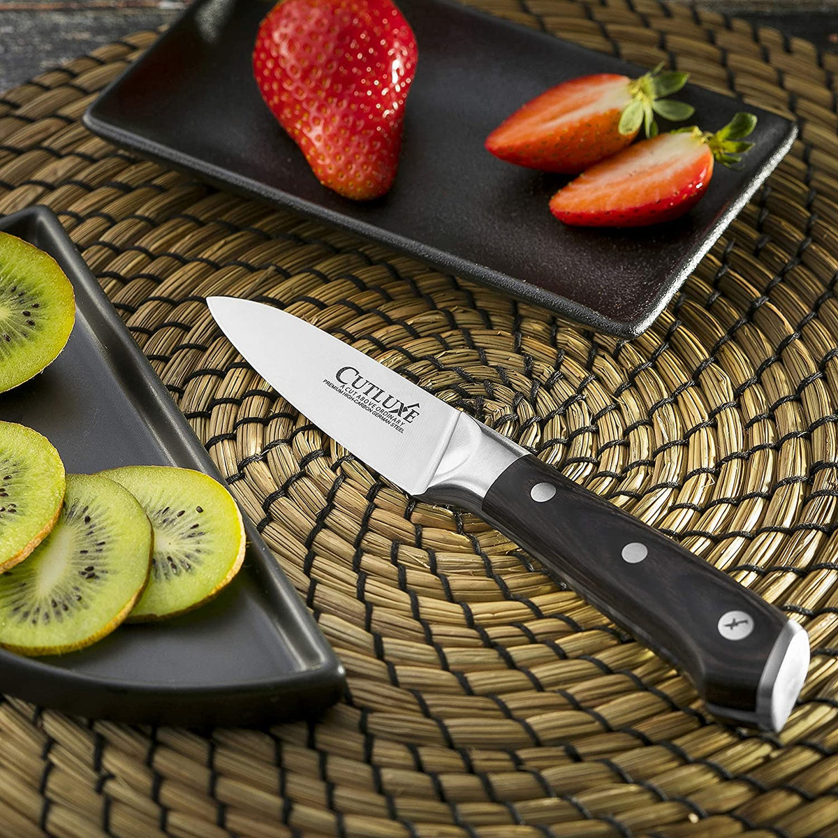 Product image 5 of 6: Premium kitchen knife slicing strawberries and kiwi on woven mat