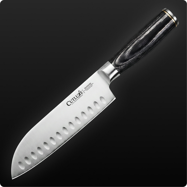 Professional chef knife with hollow edge and ergonomic black handle, ideal for precise kitchen cutting tasks.