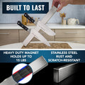 Set of knives with a magnetic strip on a kitchen counter, highlighting features like a heavy-duty magnet and stainless steel.