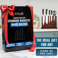 Cutluxe standing magnetic knife holder packaging with a red ribbon on a kitchen counter.