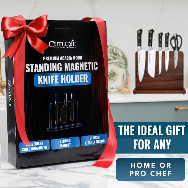 Cutluxe standing magnetic knife holder packaging with a red ribbon on a kitchen counter.