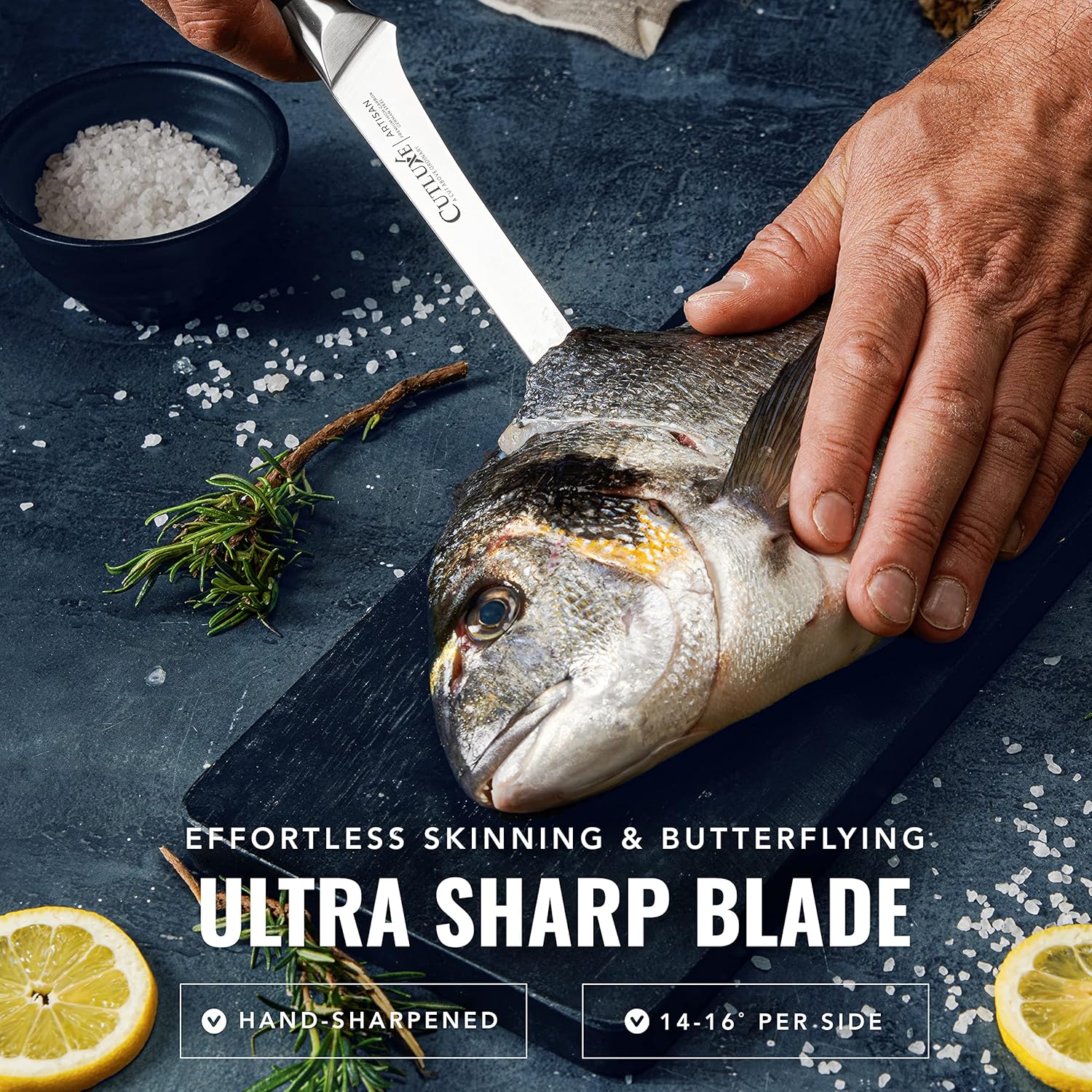 Product image 4 of 8: Ultra sharp kitchen knife skinning fresh fish on dark board with lemon, rosemary, and sea salt