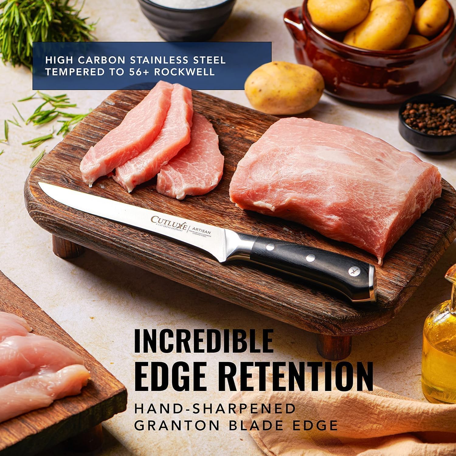 Product image 5 of 8: Cutluxe artisan knife with high carbon steel blade on wooden cutting board beside raw pork and potatoes
