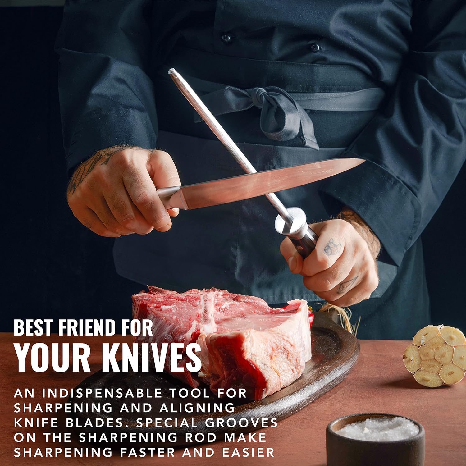 Product image 5 of 7: Chef sharpening knife with steel rod beside raw steak and garlic